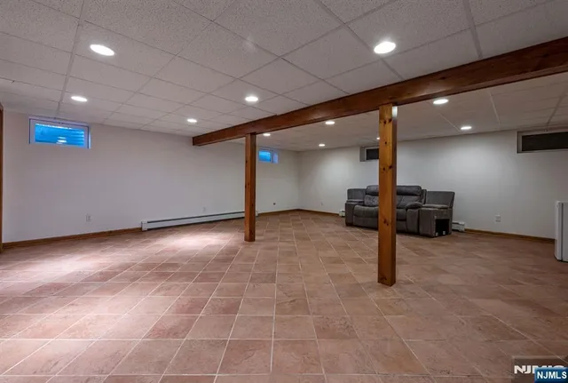 a view of an empty room with a chandelier