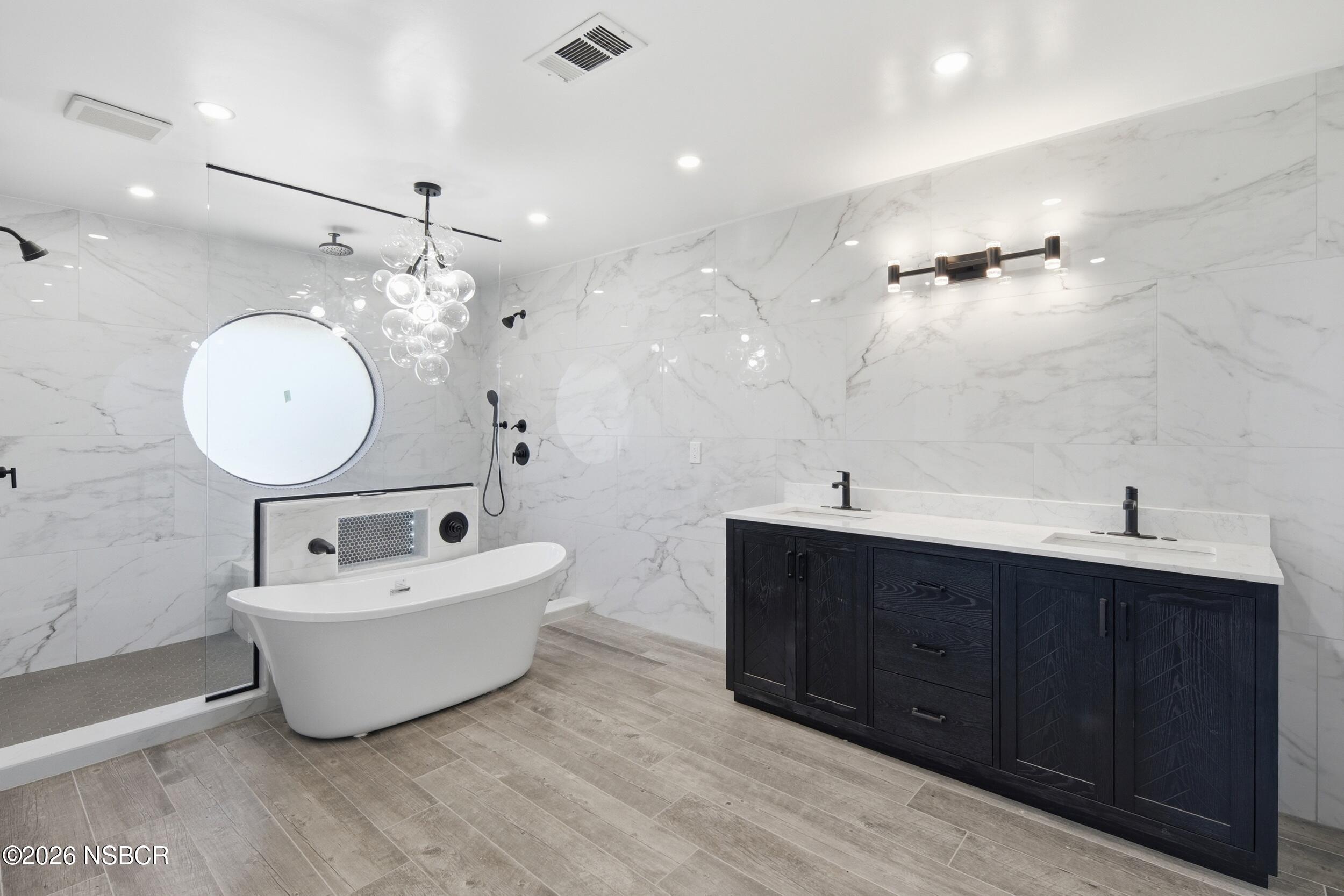 140 East Rice Ranch Road Santa Maria, CA 93455 - Photo 28 of 44 a bathroom with a double vanity sink mirror and bathtub