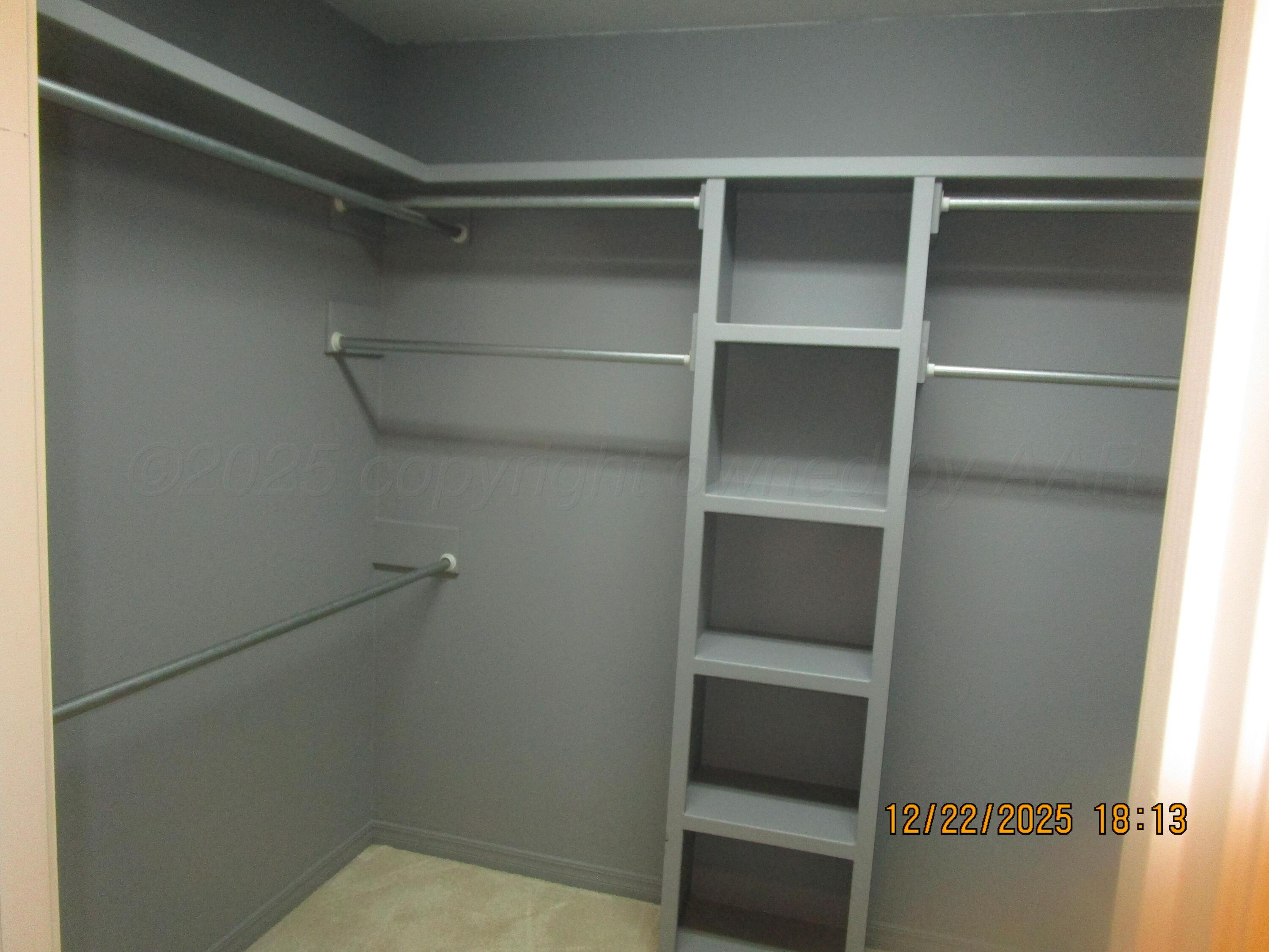 6501 Nancy Ellen Street Amarillo, TX 79119 - Photo 11 of 21 a view of an empty walk in closet