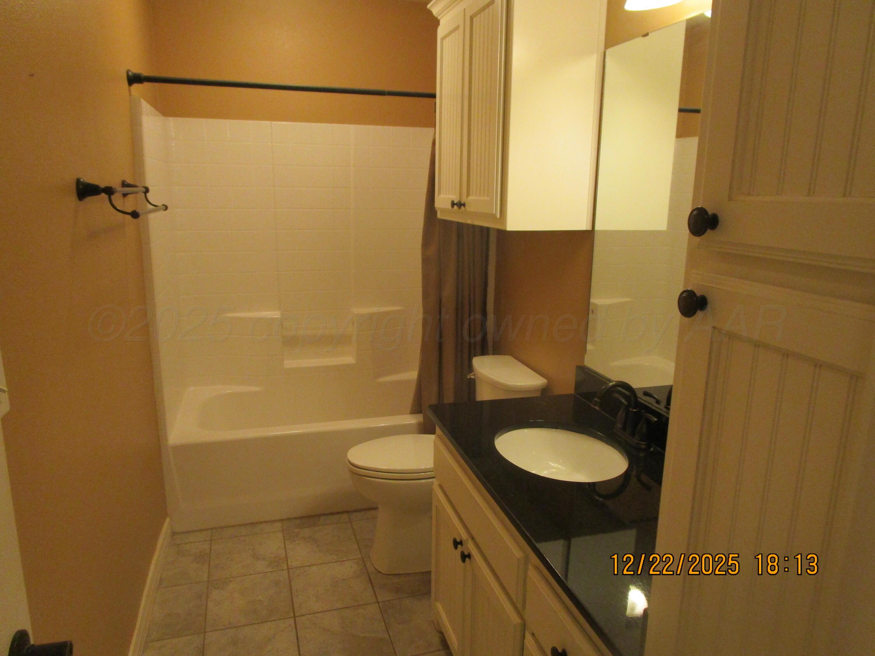 6501 Nancy Ellen Street Amarillo, TX 79119 - Photo 14 of 21 a bathroom with a sink toilet and shower