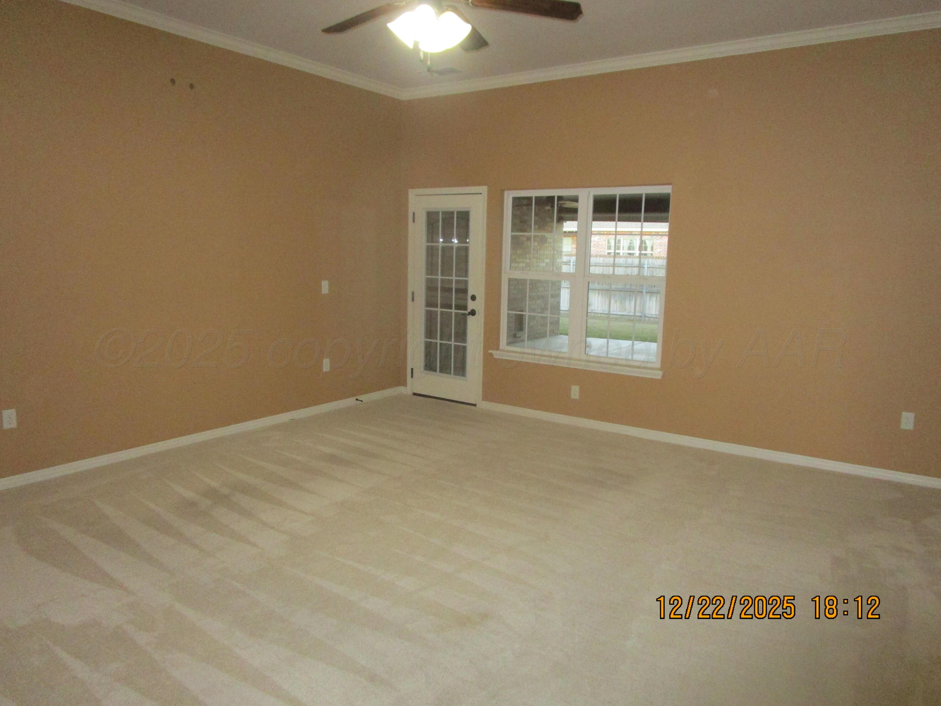 6501 Nancy Ellen Street Amarillo, TX 79119 - Photo 2 of 21 a view of an empty room with a window