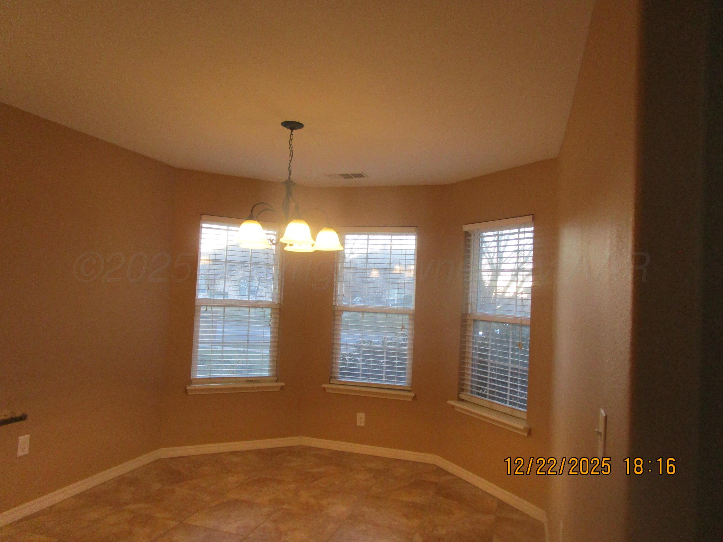 6501 Nancy Ellen Street Amarillo, TX 79119 - Photo 7 of 21 a view of an empty room with a window