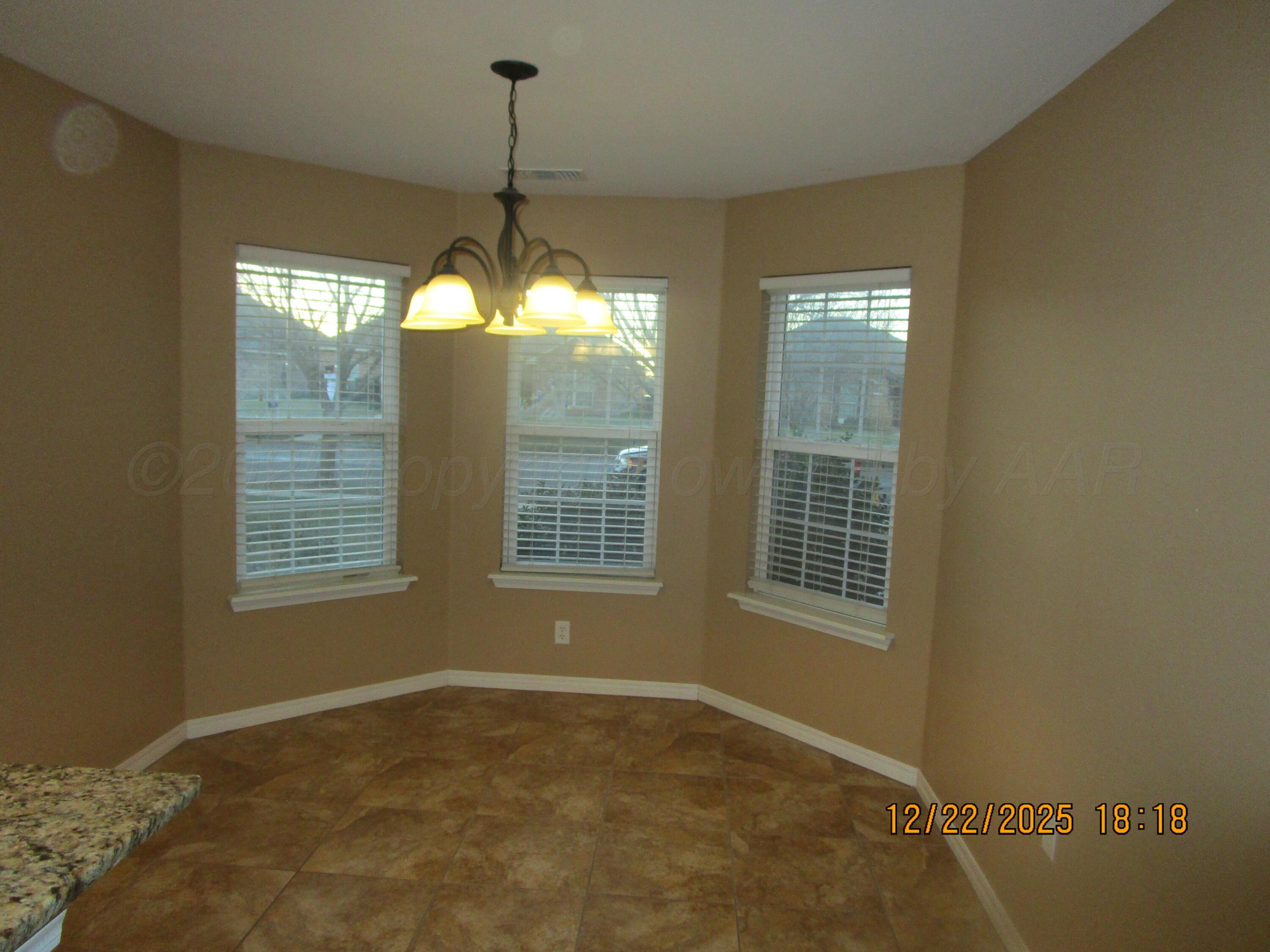 6501 Nancy Ellen Street Amarillo, TX 79119 - Photo 8 of 21 a view of an empty room with a window