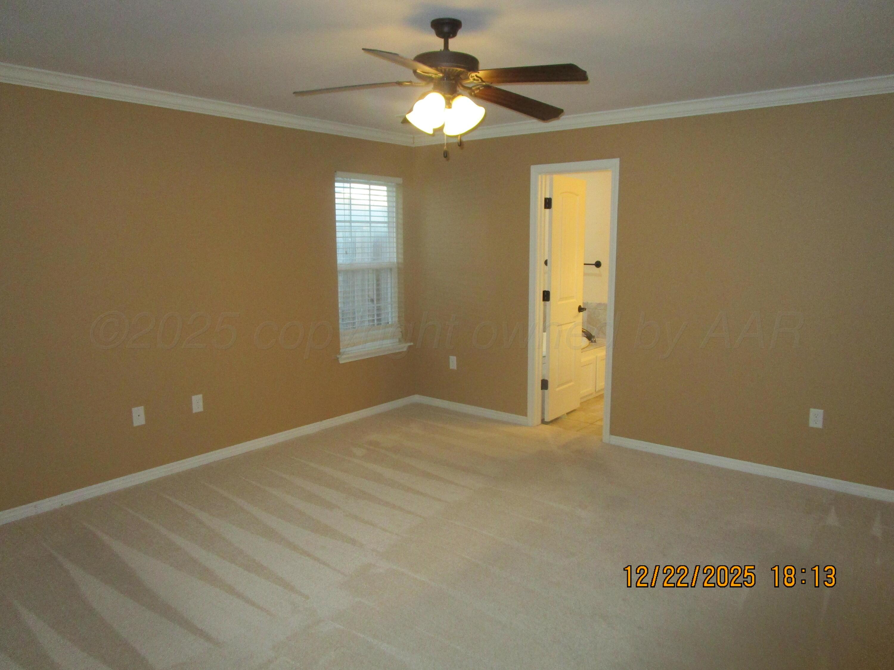 6501 Nancy Ellen Street Amarillo, TX 79119 - Photo 10 of 21 en empty room with windows and fan