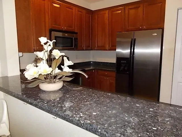 a kitchen with a sink and a stove