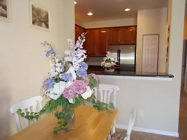 a kitchen with a table and chairs in it