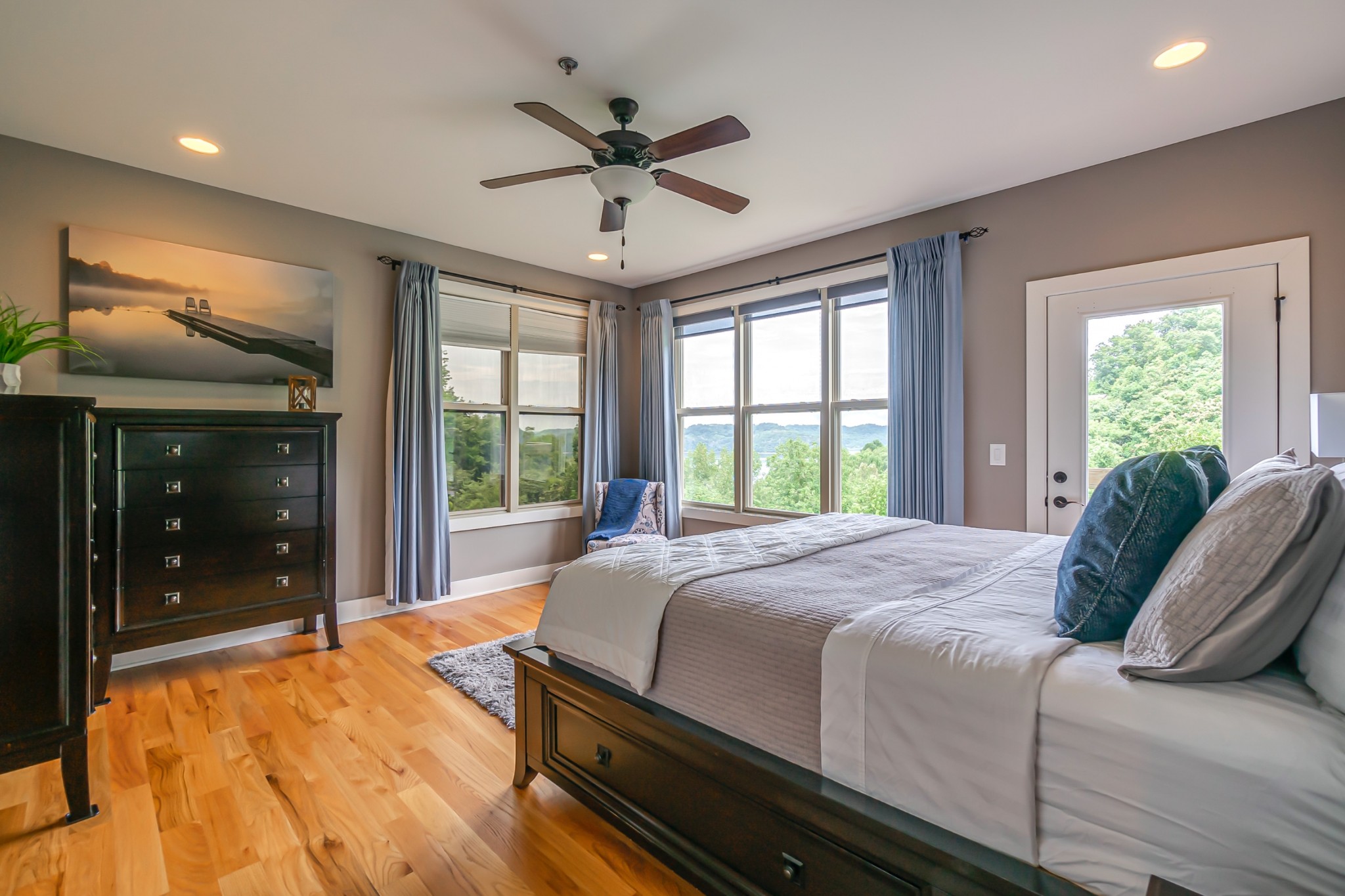 320 Floating Mill Road Silver Point, TN 38582 - Photo 16 of 41 a bedroom with a large bed and a large window