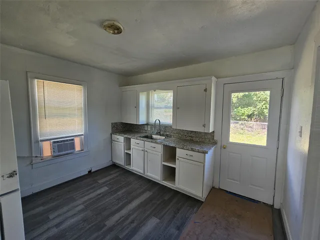 a kitchen with stainless steel appliances granite countertop a stove and a refrigerator