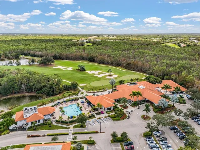a living room with lots of furniture and a chandelier