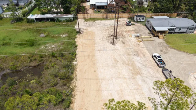 a swimming pool with outdoor seating and yard