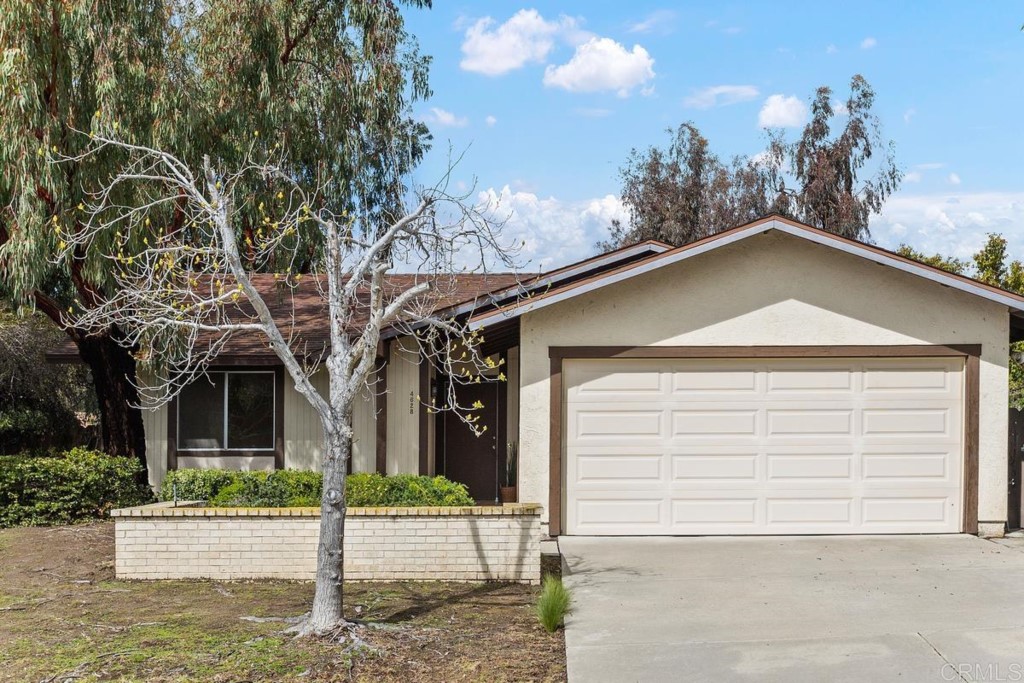 4628 Mystik Road Oceanside, CA 92056 - Photo 1 of 1 a front view of a house with garden