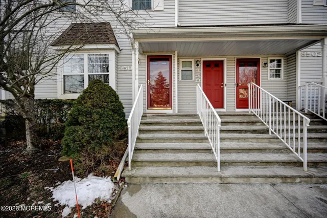 a view of a house with more windows and plants