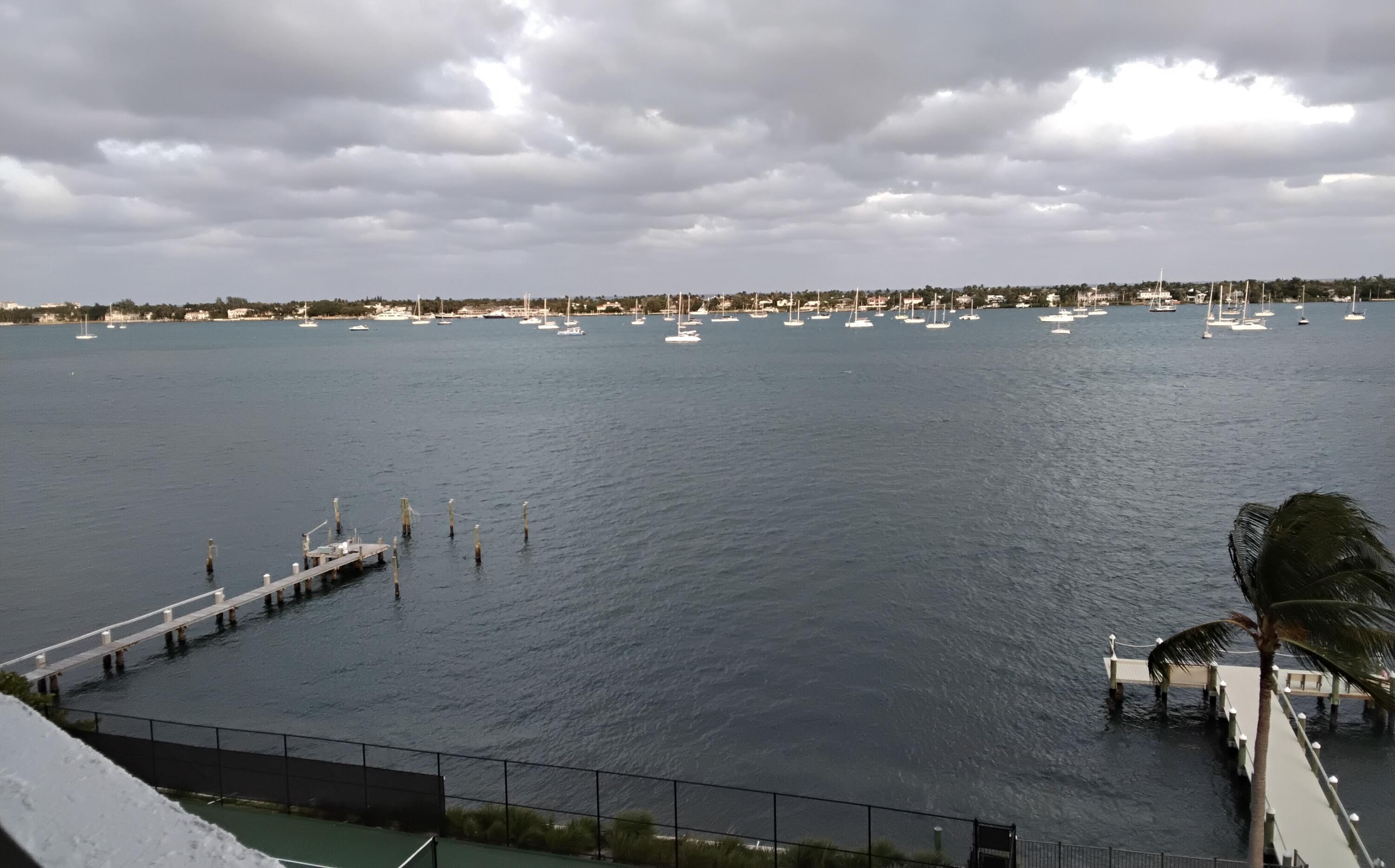 5200 North Flagler Drive, Unit 702 West Palm Beach, FL 33407 - Photo 2 of 36 a view of a lake and outdoor space