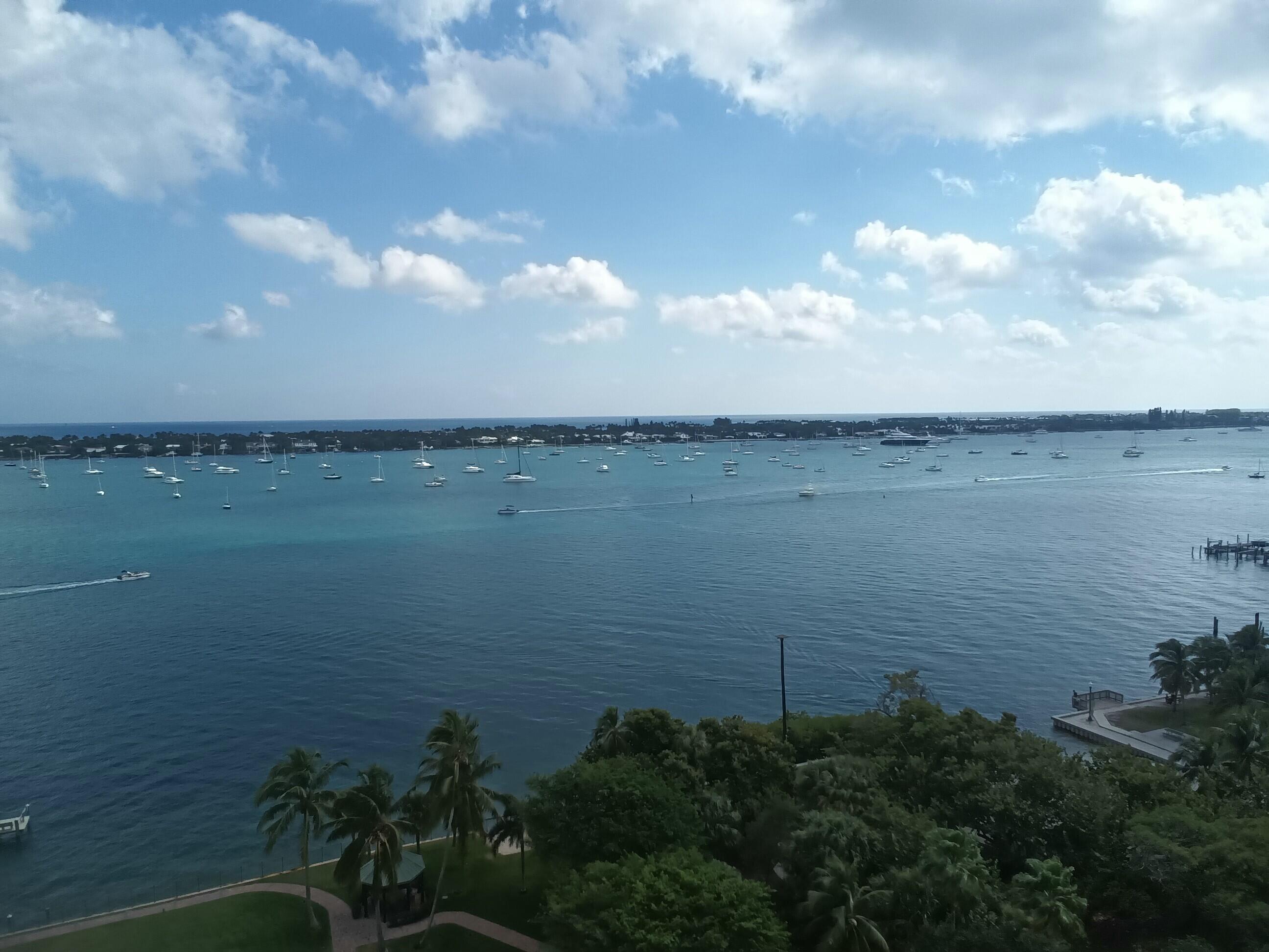 5200 North Flagler Drive, Unit 702 West Palm Beach, FL 33407 - Photo 21 of 36 a view of a lake from a yard