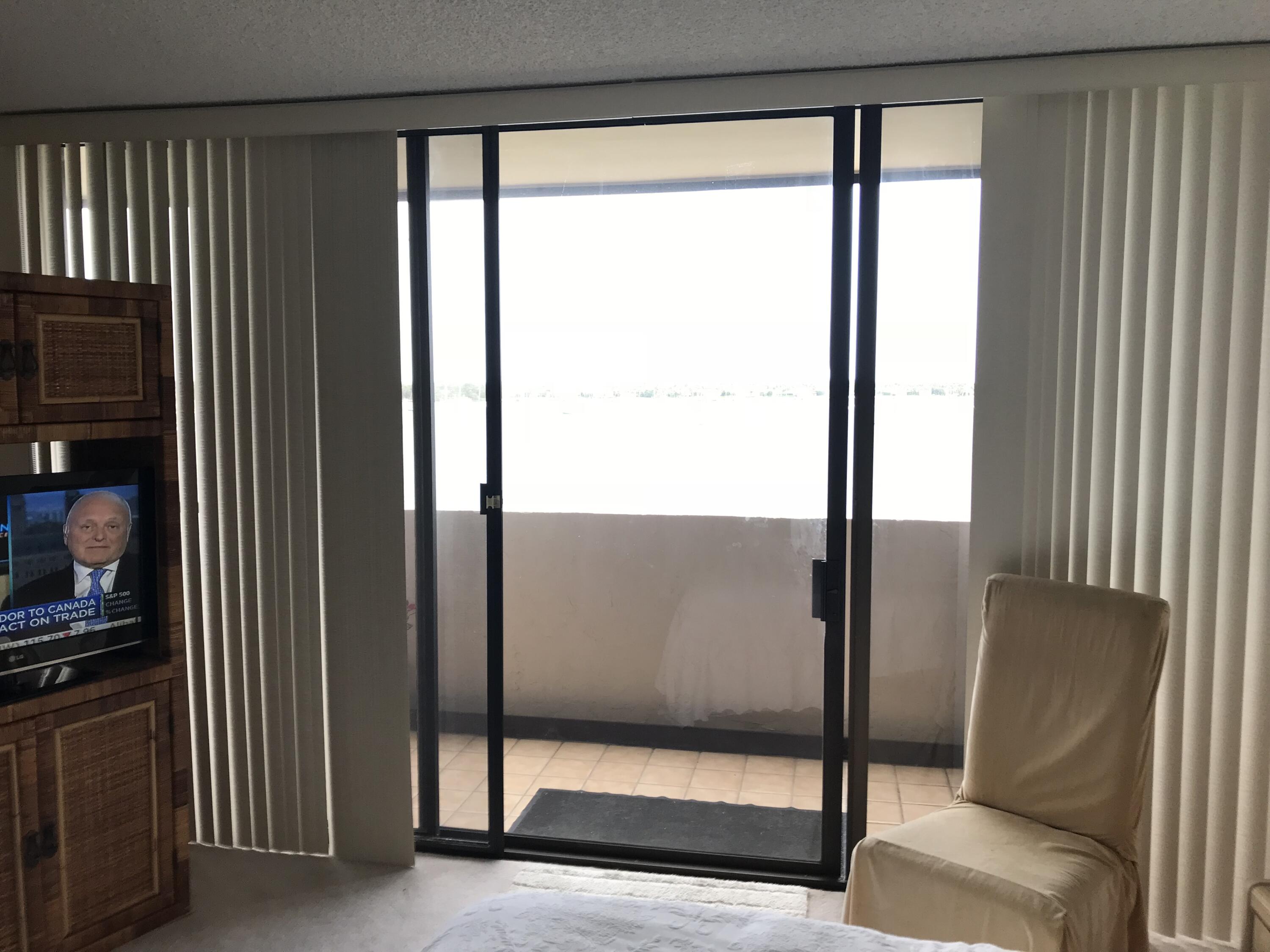 5200 North Flagler Drive, Unit 702 West Palm Beach, FL 33407 - Photo 32 of 36 a view of front door with porch