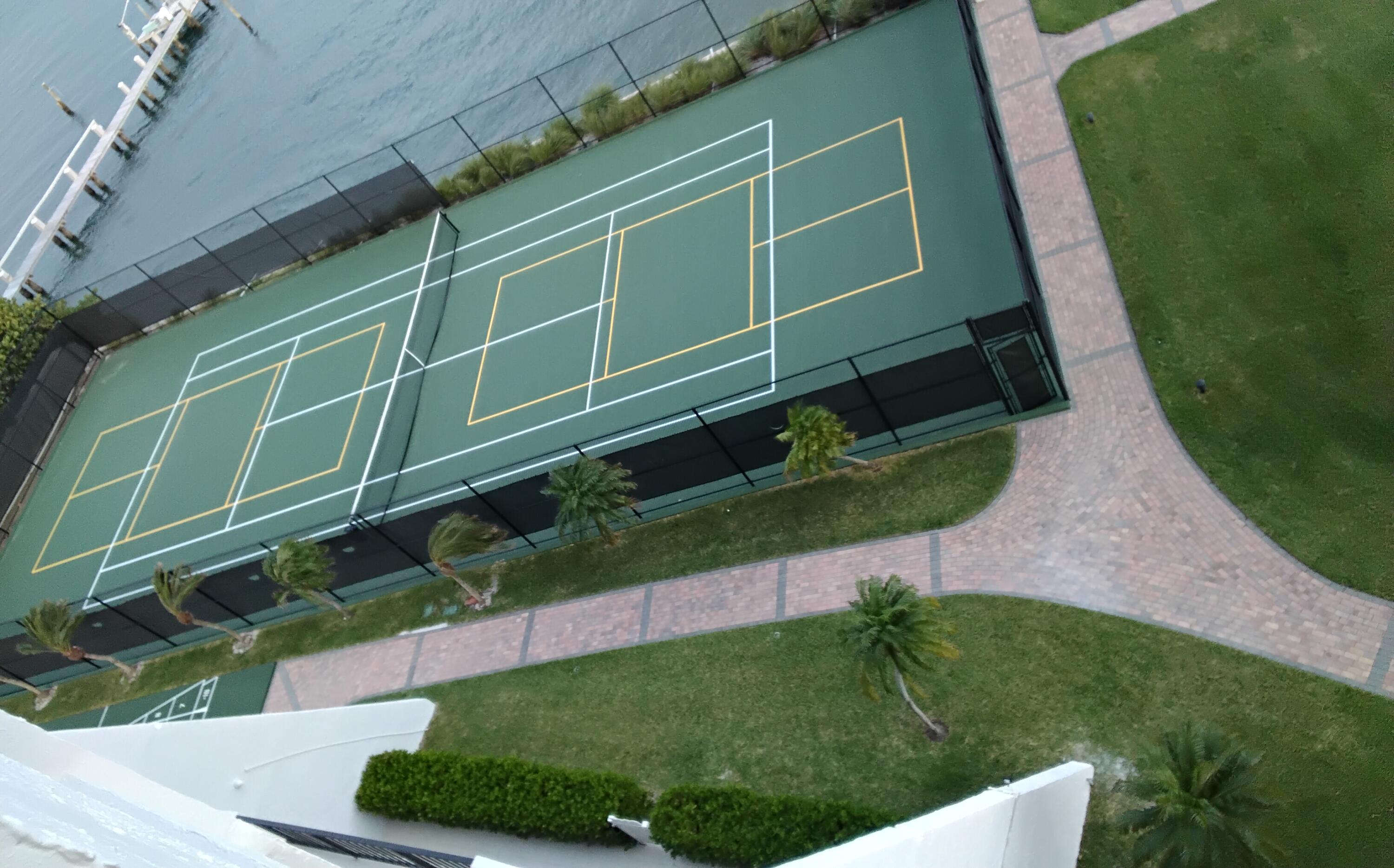 5200 North Flagler Drive, Unit 702 West Palm Beach, FL 33407 - Photo 5 of 36 a green field with trees in the background