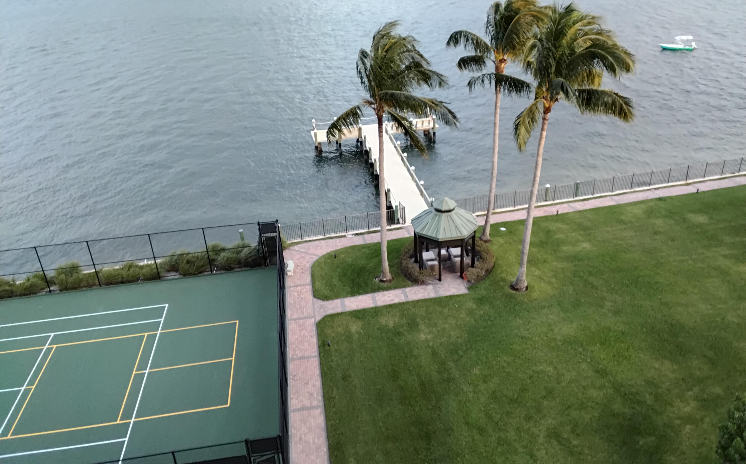 5200 North Flagler Drive, Unit 702 West Palm Beach, FL 33407 - Photo 7 of 36 a view of a swimming pool with a bench