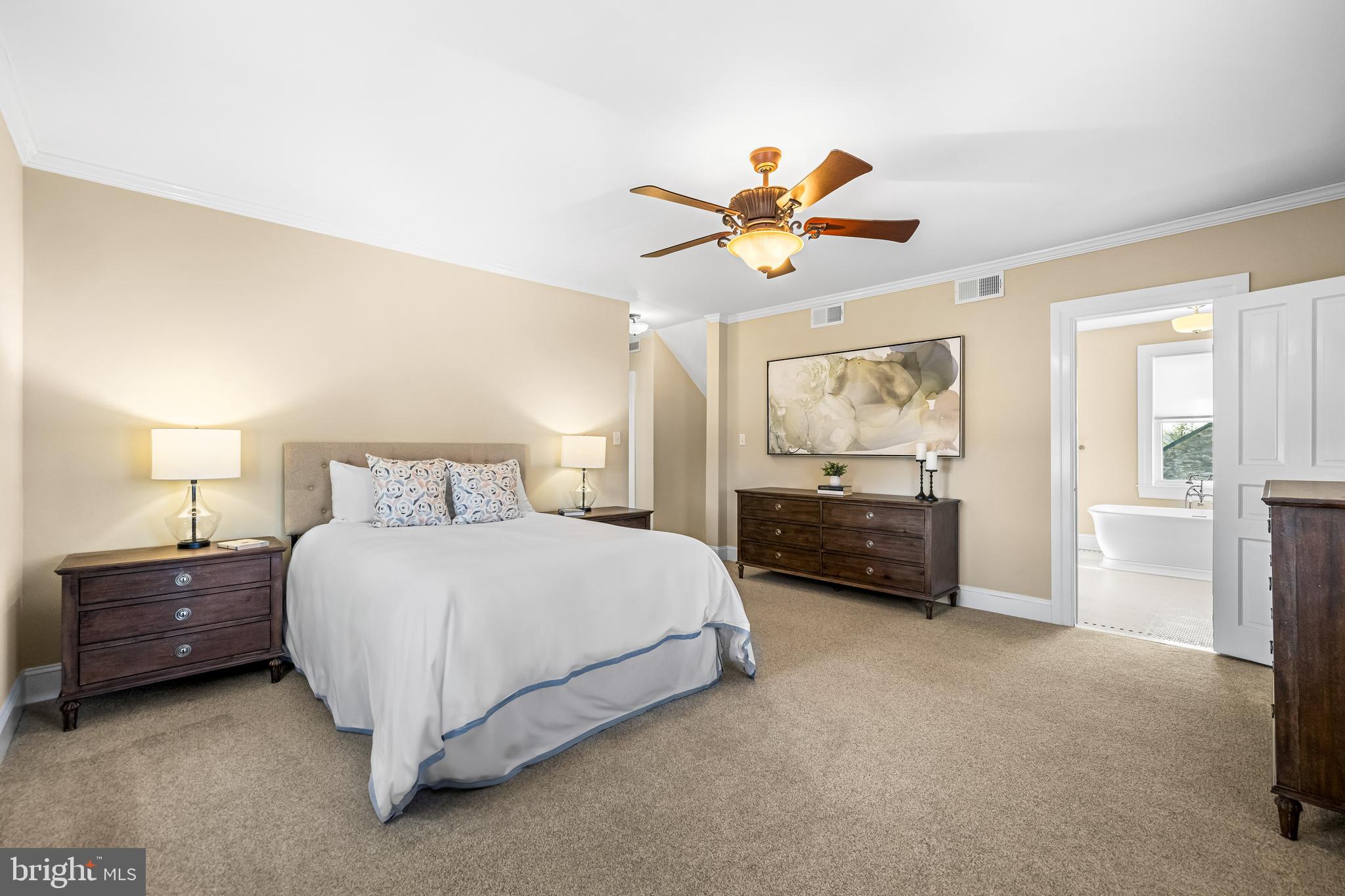 13128 Long Green Pike Baldwin, MD 21013 - Photo 56 of 124 a bedroom with a bed and a chandelier