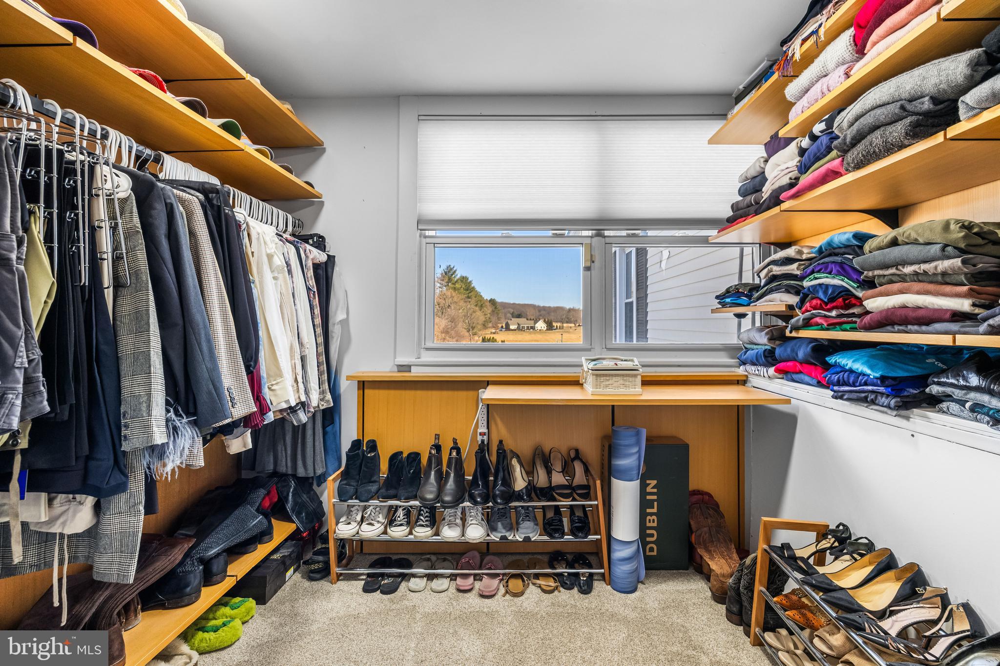 13128 Long Green Pike Baldwin, MD 21013 - Photo 61 of 124 a view of walk in closet with clothes and shoes