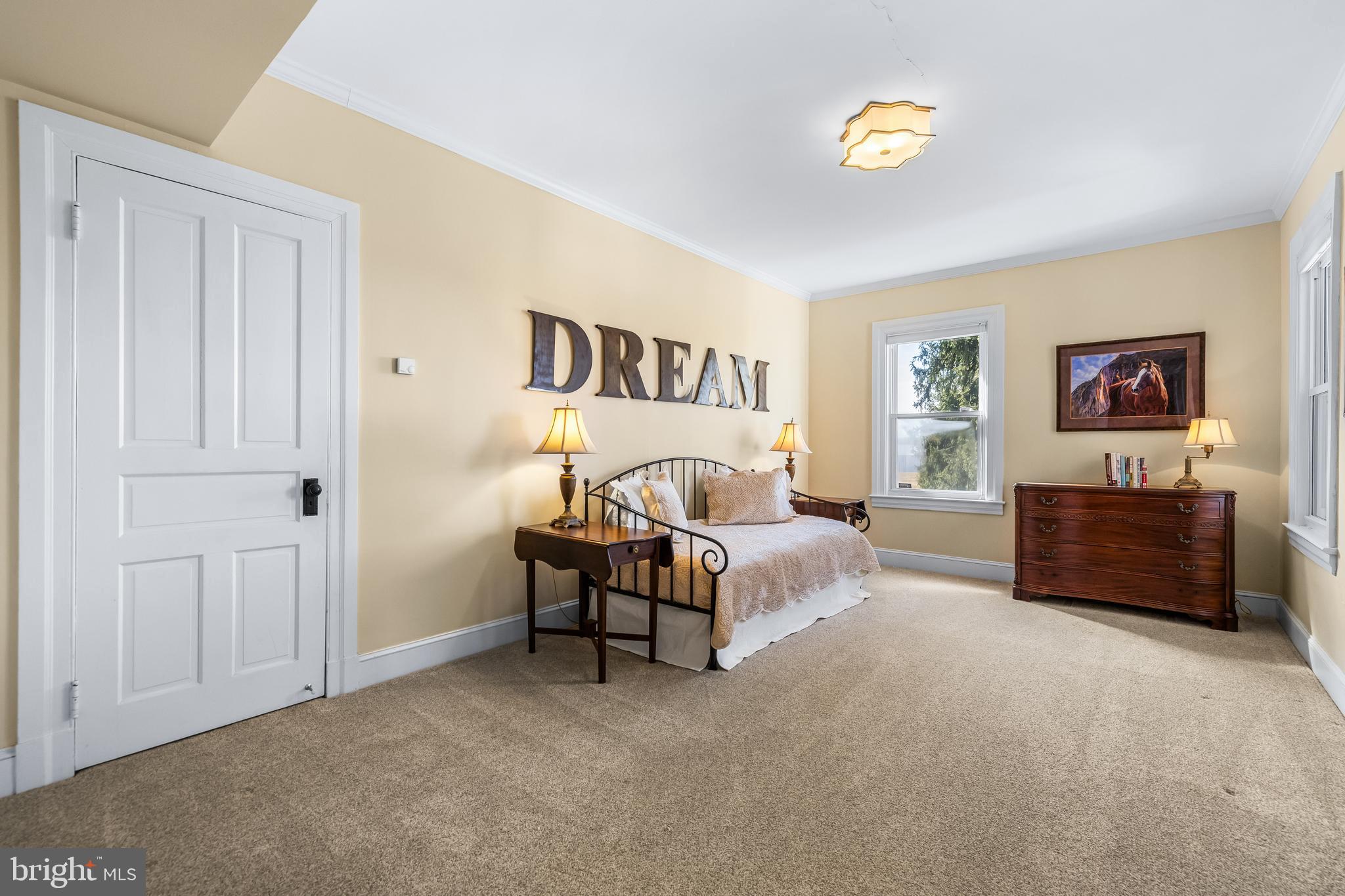 13128 Long Green Pike Baldwin, MD 21013 - Photo 62 of 124 a spacious bedroom with a bed and a couch