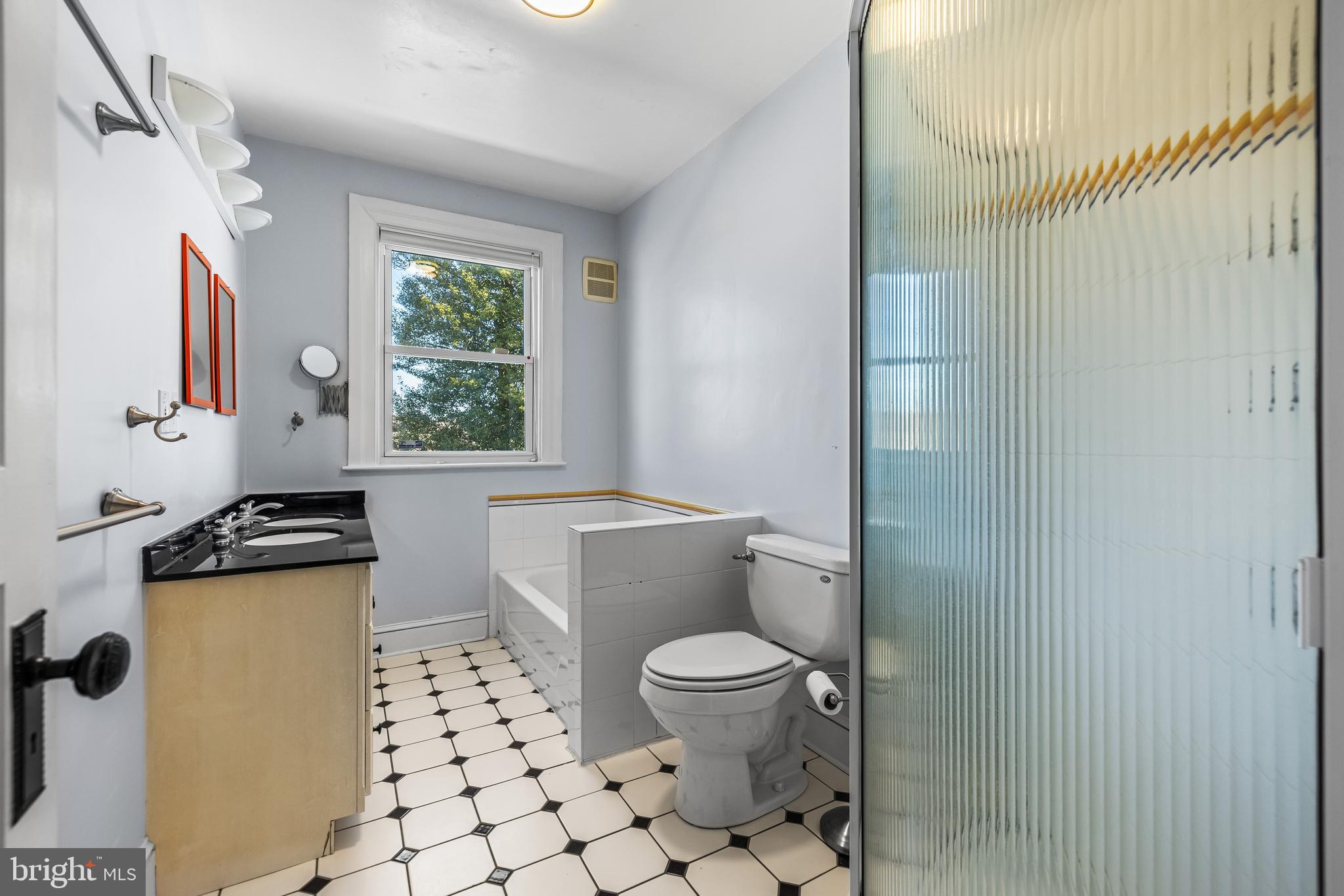 13128 Long Green Pike Baldwin, MD 21013 - Photo 69 of 124 a bathroom with a toilet a sink and a mirror