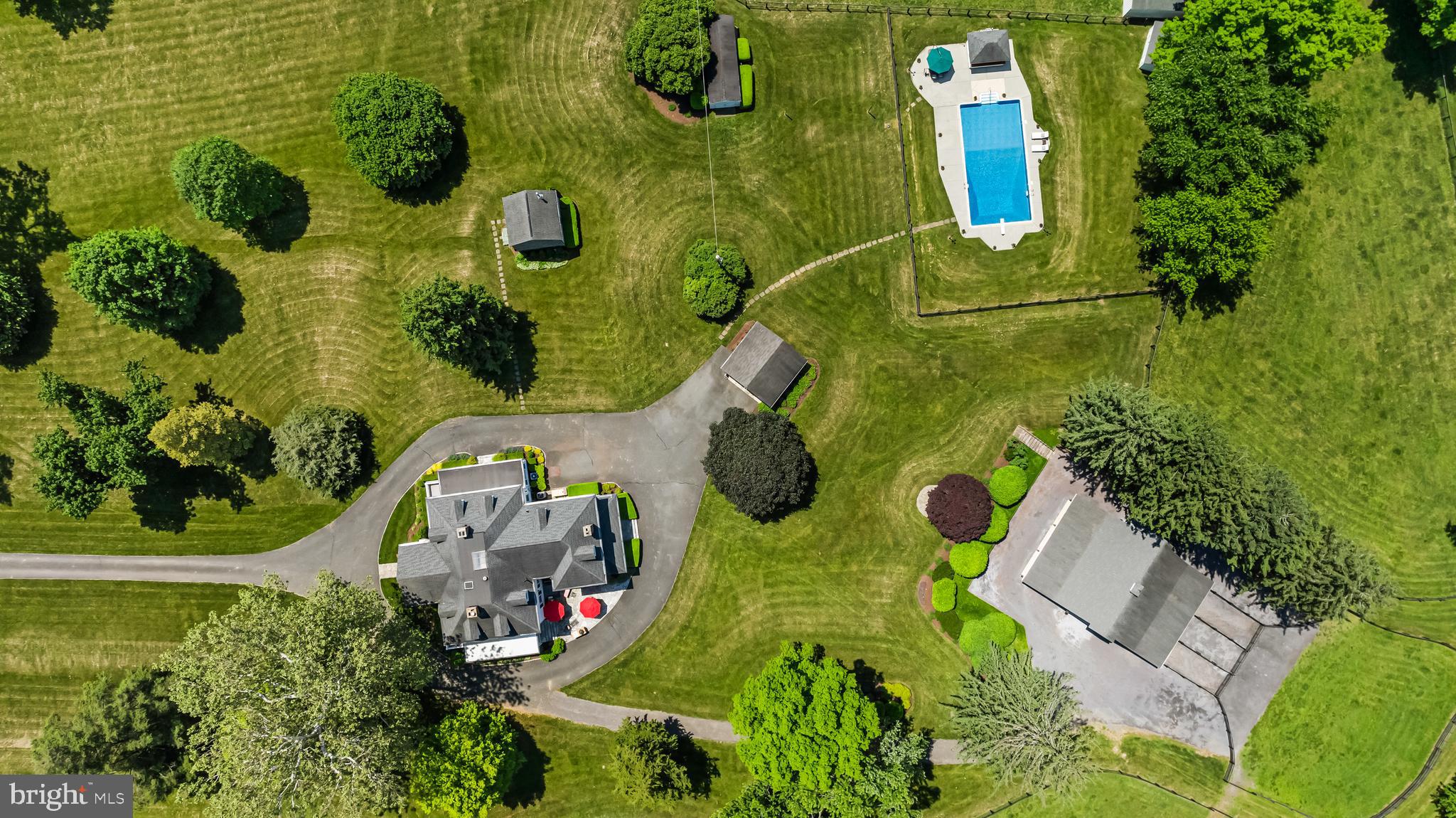 13128 Long Green Pike Baldwin, MD 21013 - Photo 8 of 124 an aerial view of a house with a yard and large trees