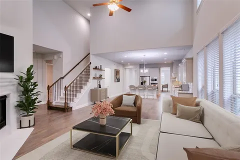 a living room with furniture or wooden floor and a chandelier