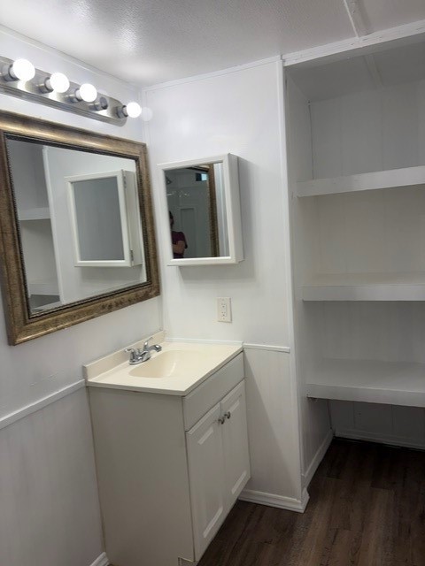 154 Mills Village Road Livingston, TX 77351 - Photo 16 of 16 Single vanity and linen cabinet shelving primary bathroom