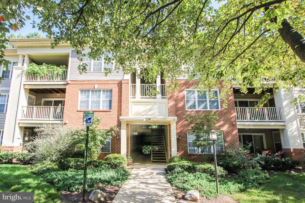 119 Timberbrook Lane, Unit 101 Gaithersburg, MD 20878 - Photo 1 of 29 front view of a house with a yard