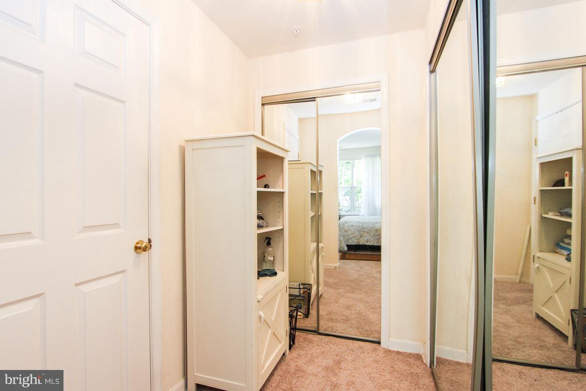119 Timberbrook Lane, Unit 101 Gaithersburg, MD 20878 - Photo 18 of 29 a bathroom with a glass shower door