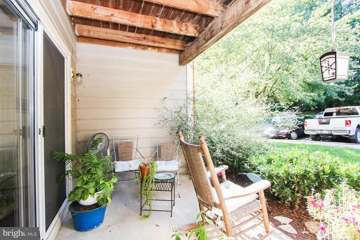 119 Timberbrook Lane, Unit 101 Gaithersburg, MD 20878 - Photo 24 of 29 a view of chair and table potted plant