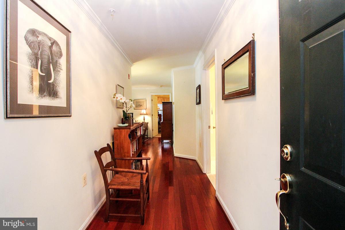 119 Timberbrook Lane, Unit 101 Gaithersburg, MD 20878 - Photo 4 of 29 a view of a dining room with furniture and wooden floor