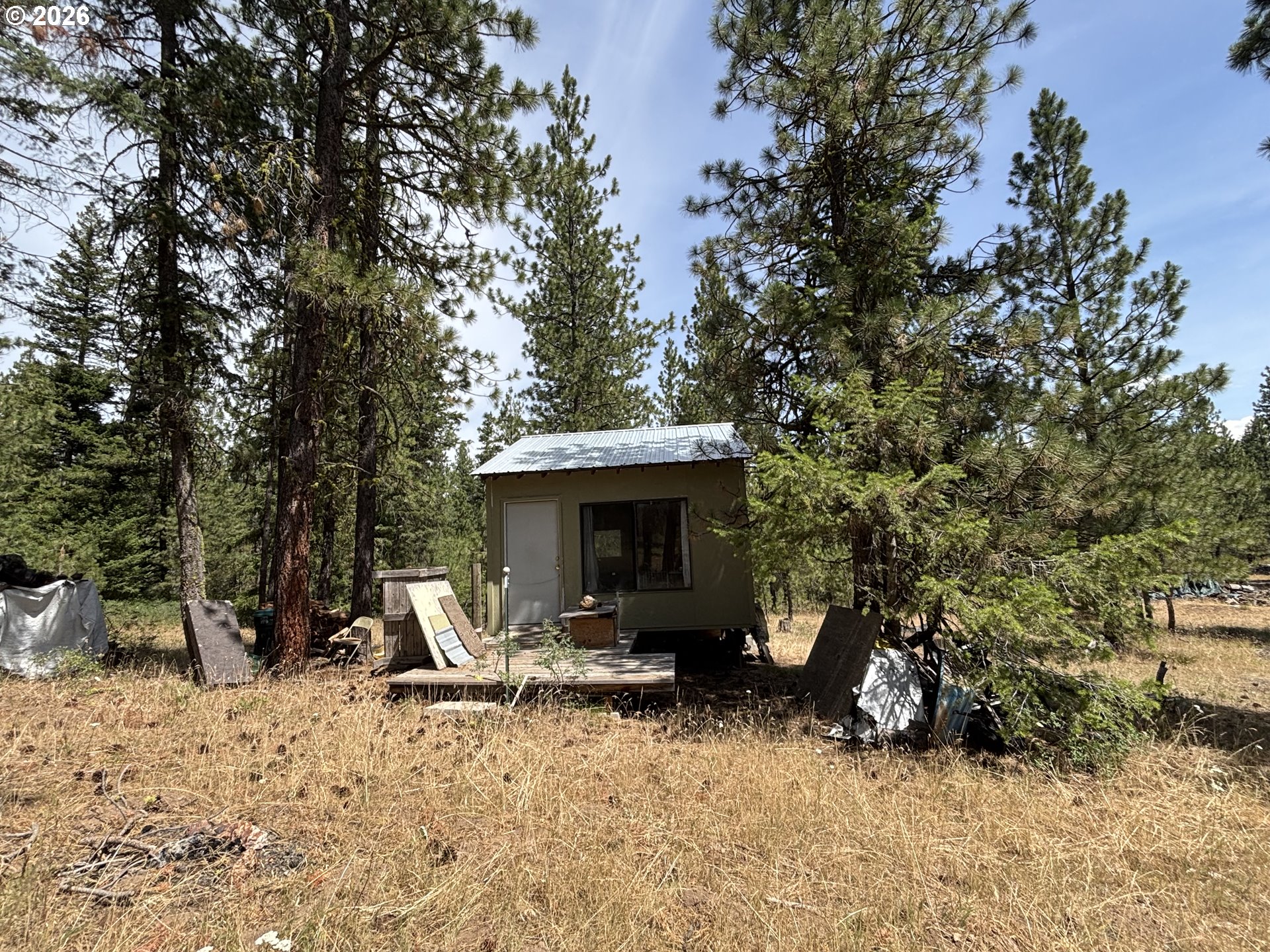 Sparta Road Baker City, OR 97814 - Photo 22 of 26 a view of a house with a yard fire pit and trees