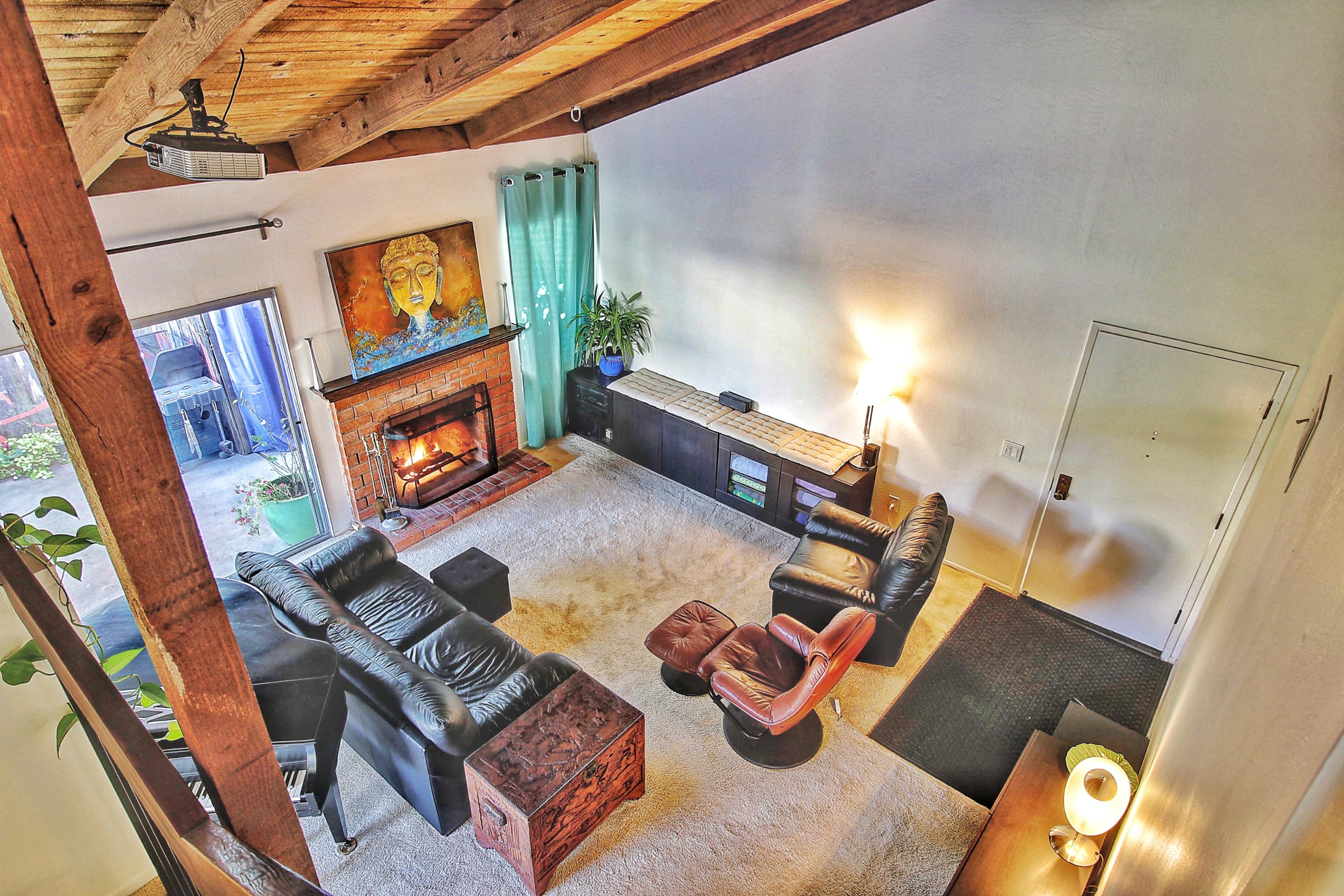 a view of a living room with furniture and a flat screen tv