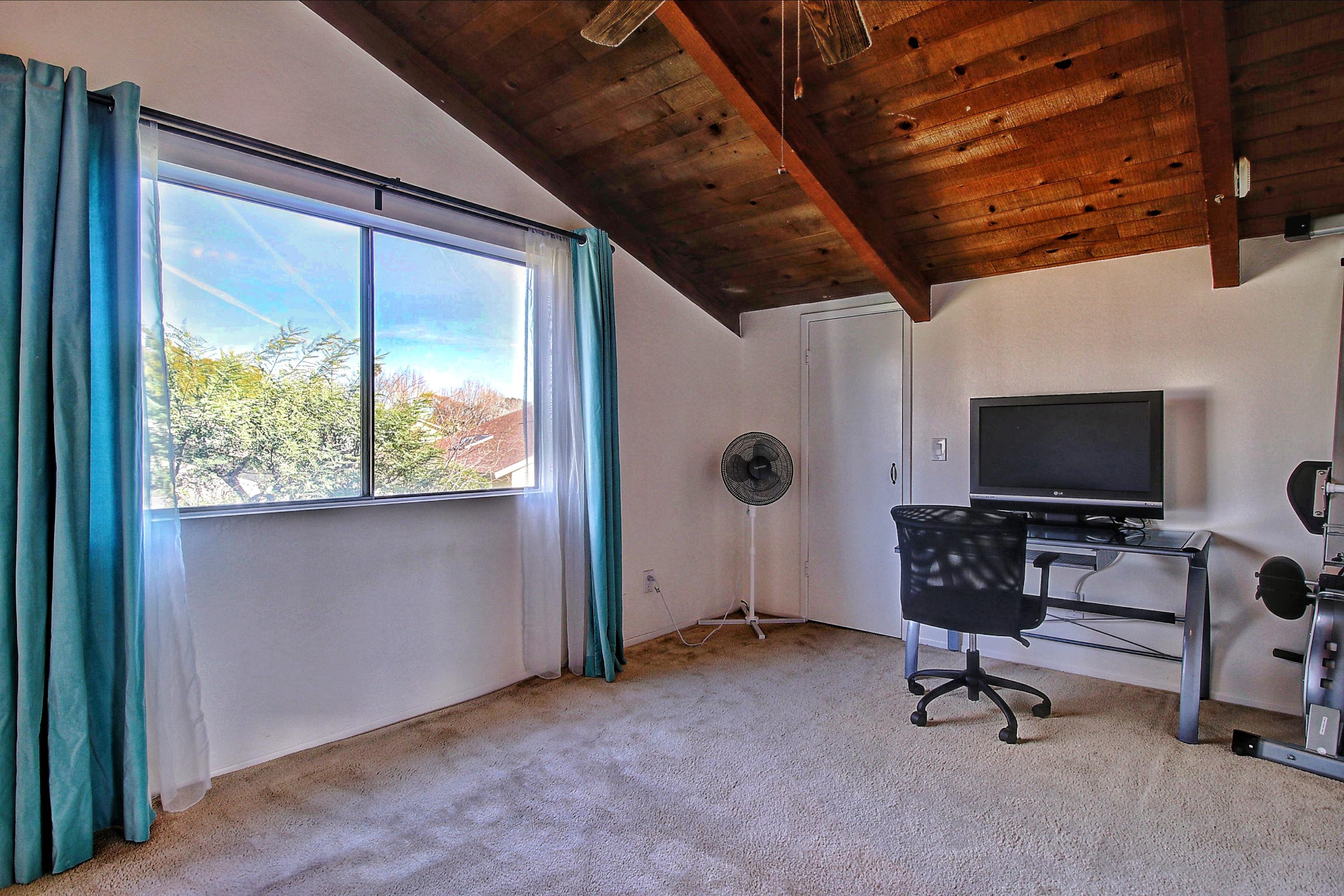 51 North San Marcos Road, Unit B Santa Barbara, CA 93111 - Photo 12 of 24 a view of a livingroom with workspace and a window