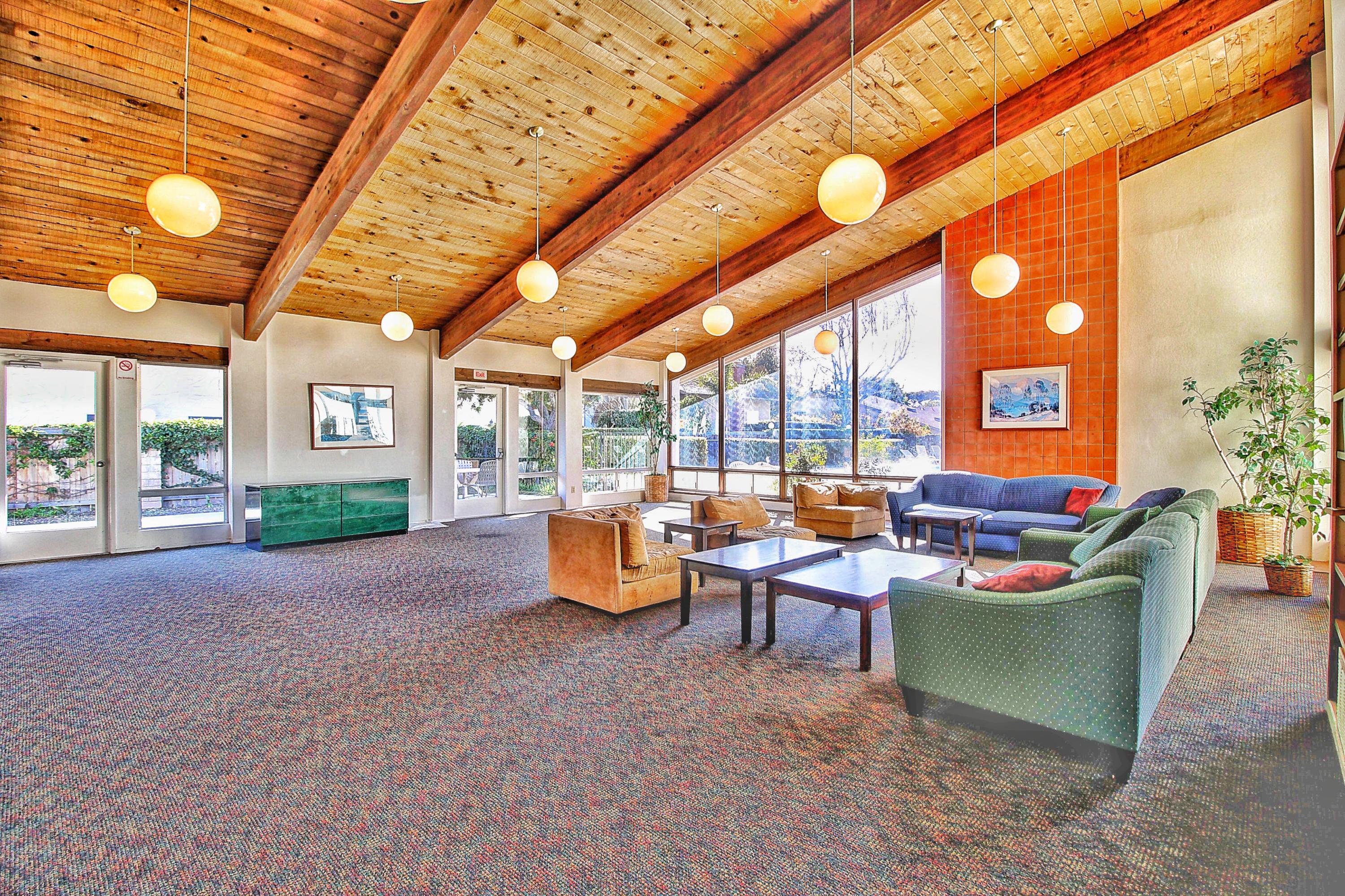 51 North San Marcos Road, Unit B Santa Barbara, CA 93111 - Photo 23 of 24 a living room with furniture a large window and chandelier