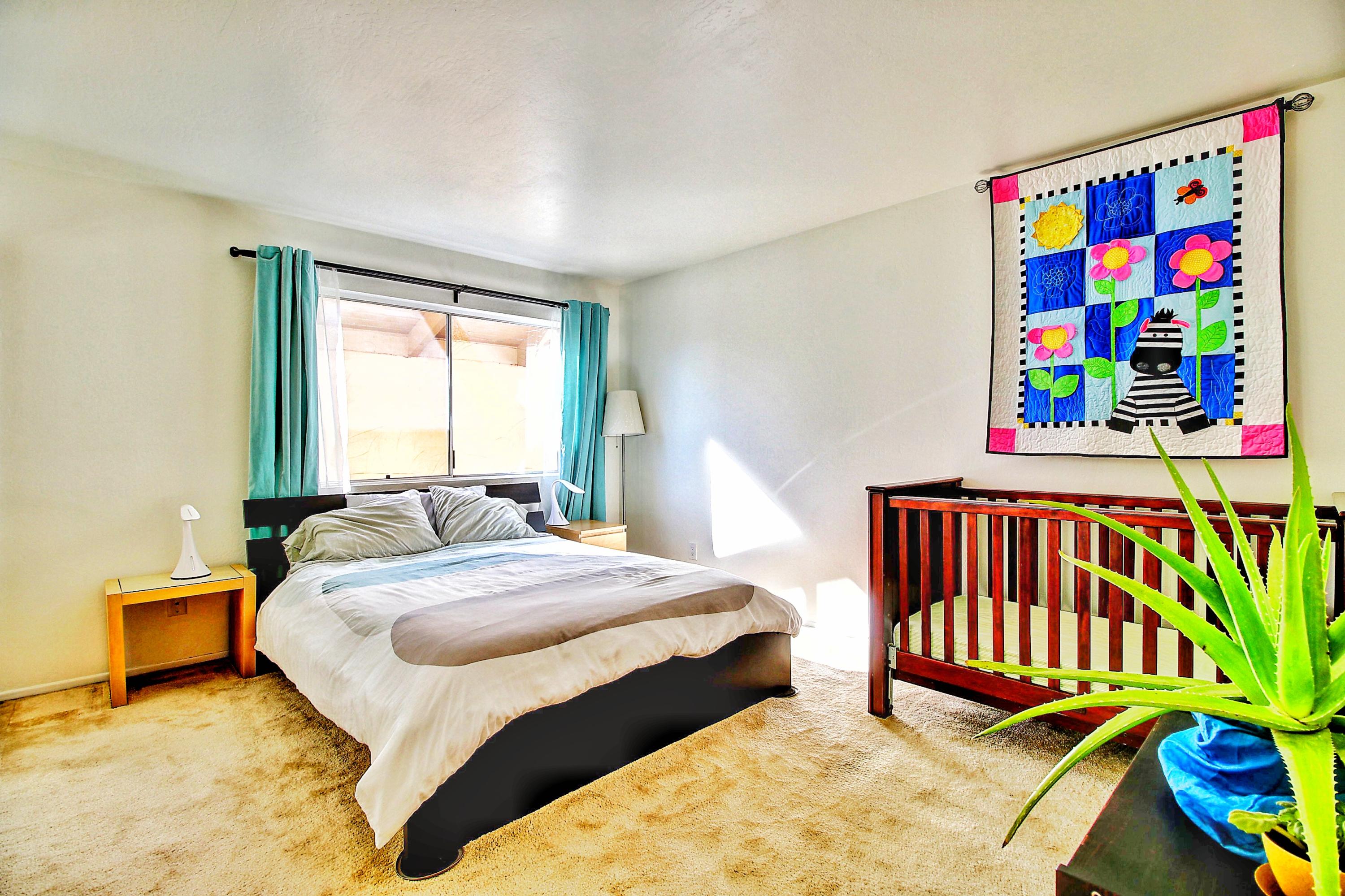 51 North San Marcos Road, Unit B Santa Barbara, CA 93111 - Photo 10 of 24 a bedroom with a bed and a book shelf