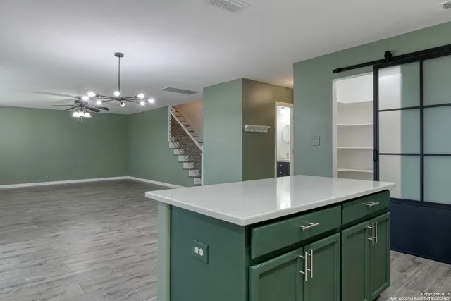 a room with a table and chandelier