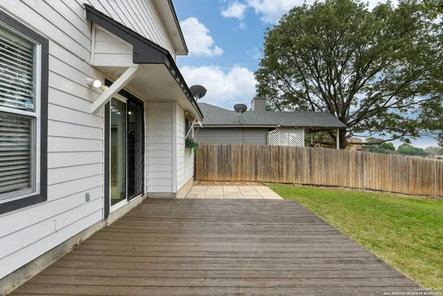 a view of a backyard with a small pool