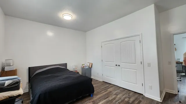 a bedroom with a bed and a closet