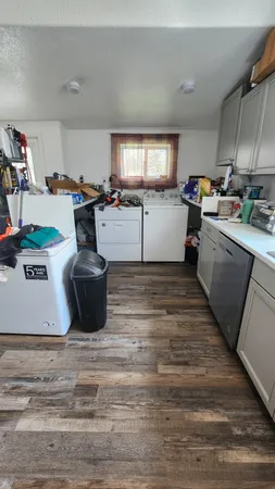 a kitchen with sink and cabinets