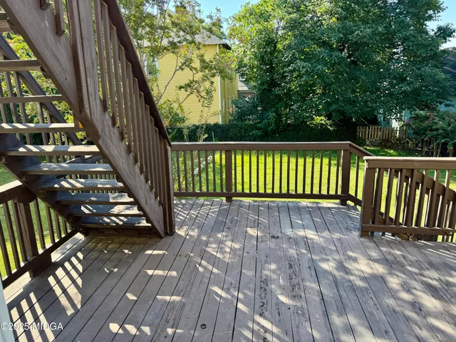 a view of balcony with wooden floor