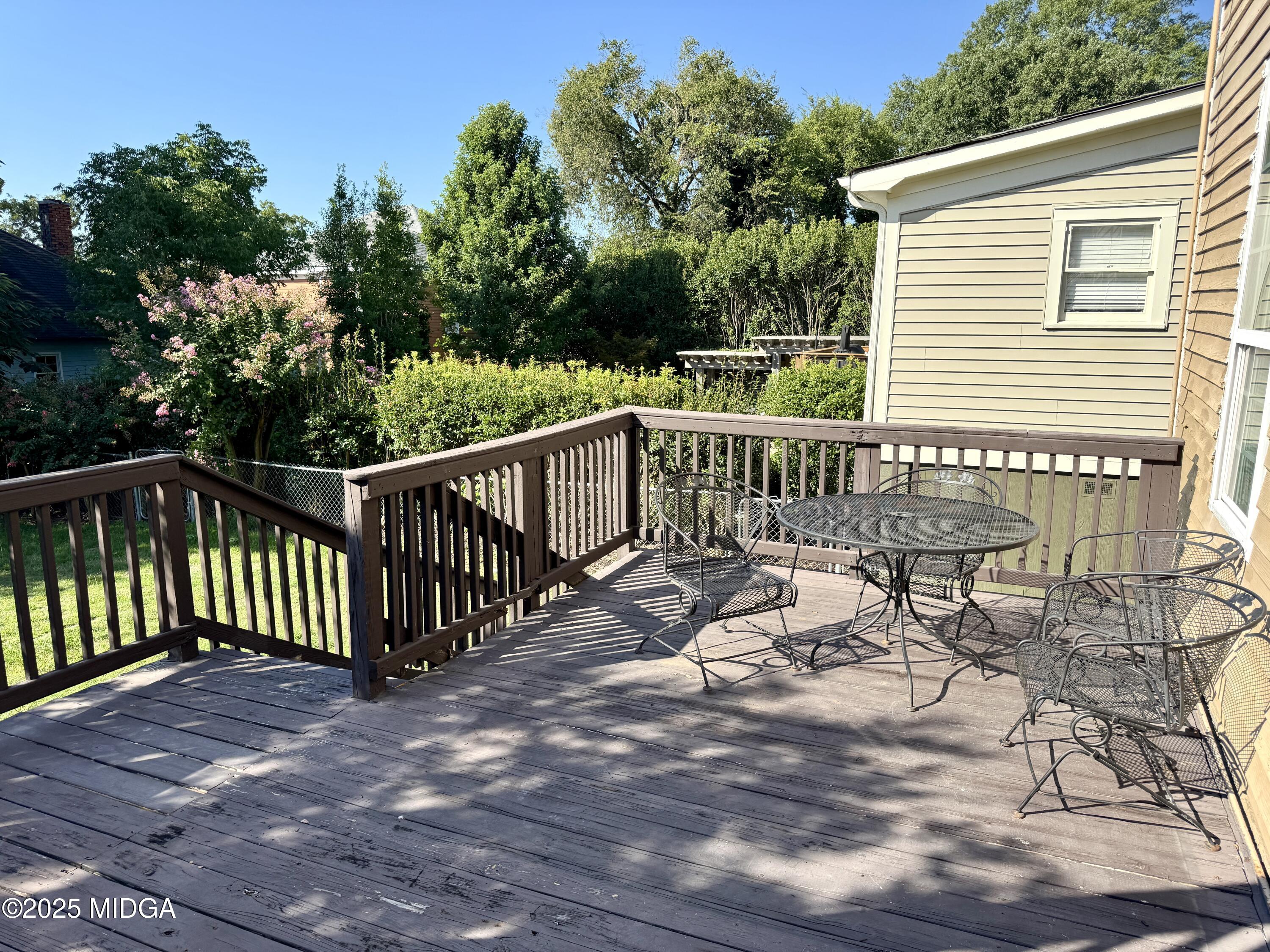 940 Cole Street Macon, GA 31201 - Photo 18 of 22 a view of a chair and table on the wooden floor