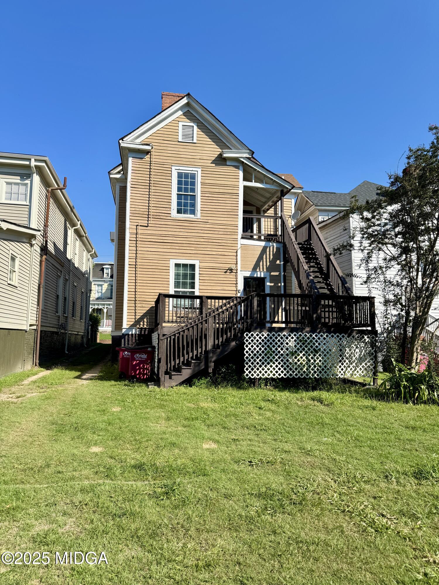 940 Cole Street Macon, GA 31201 - Photo 20 of 22 a view of a house with a yard and sitting area