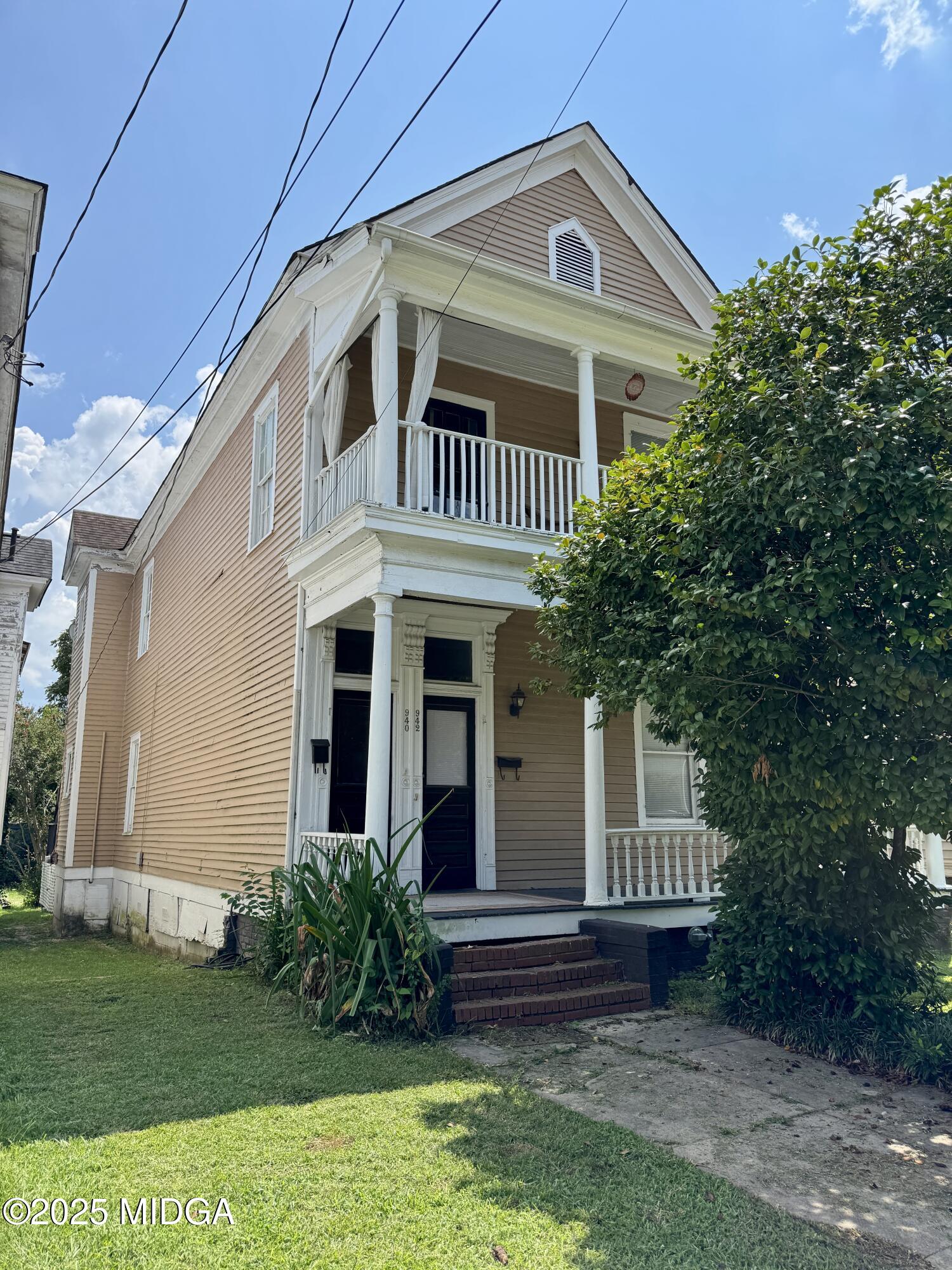 940 Cole Street Macon, GA 31201 - Photo 21 of 22 a front view of a house with garden
