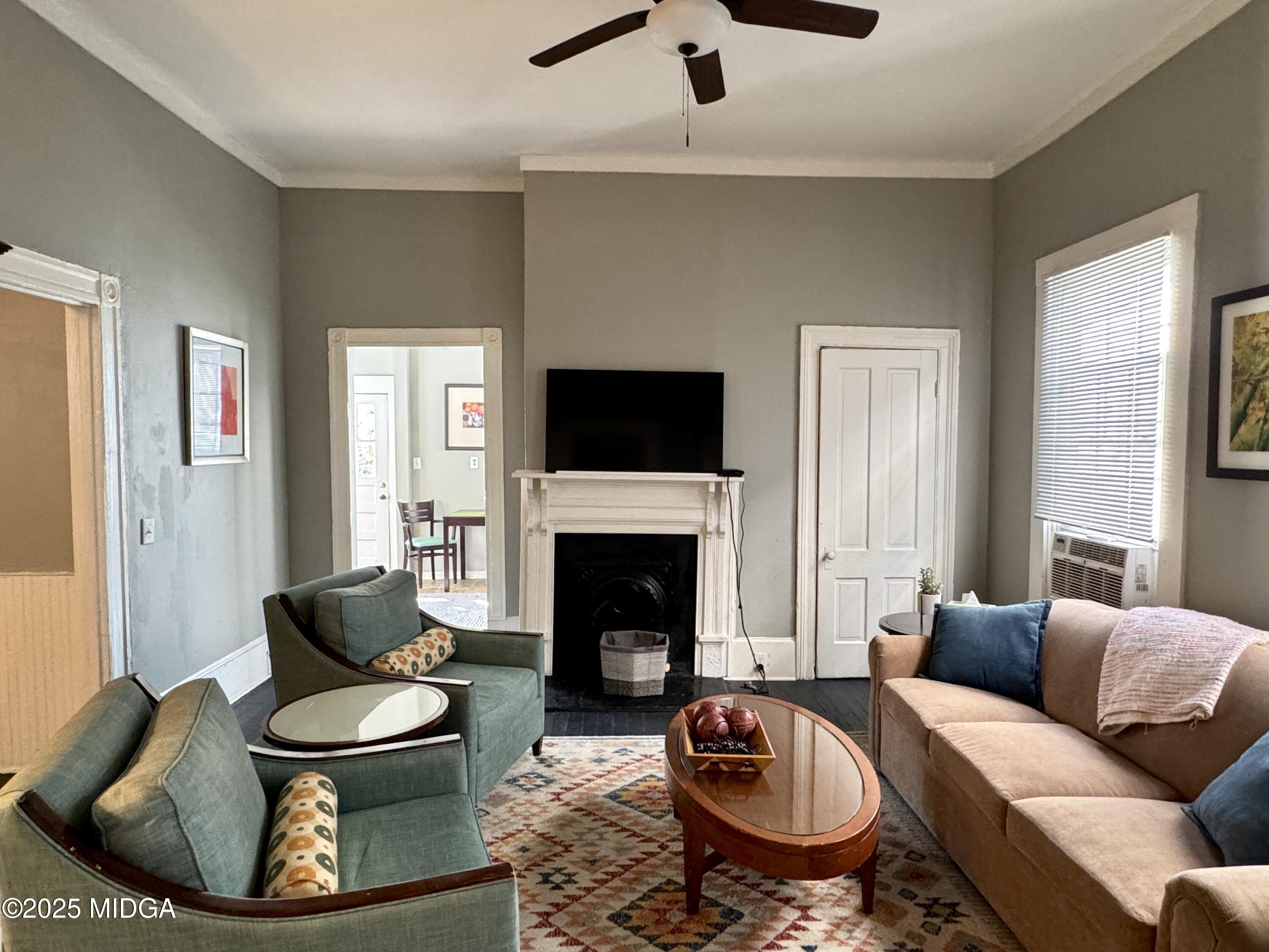 940 Cole Street Macon, GA 31201 - Photo 4 of 22 a living room with furniture a fireplace and a large window