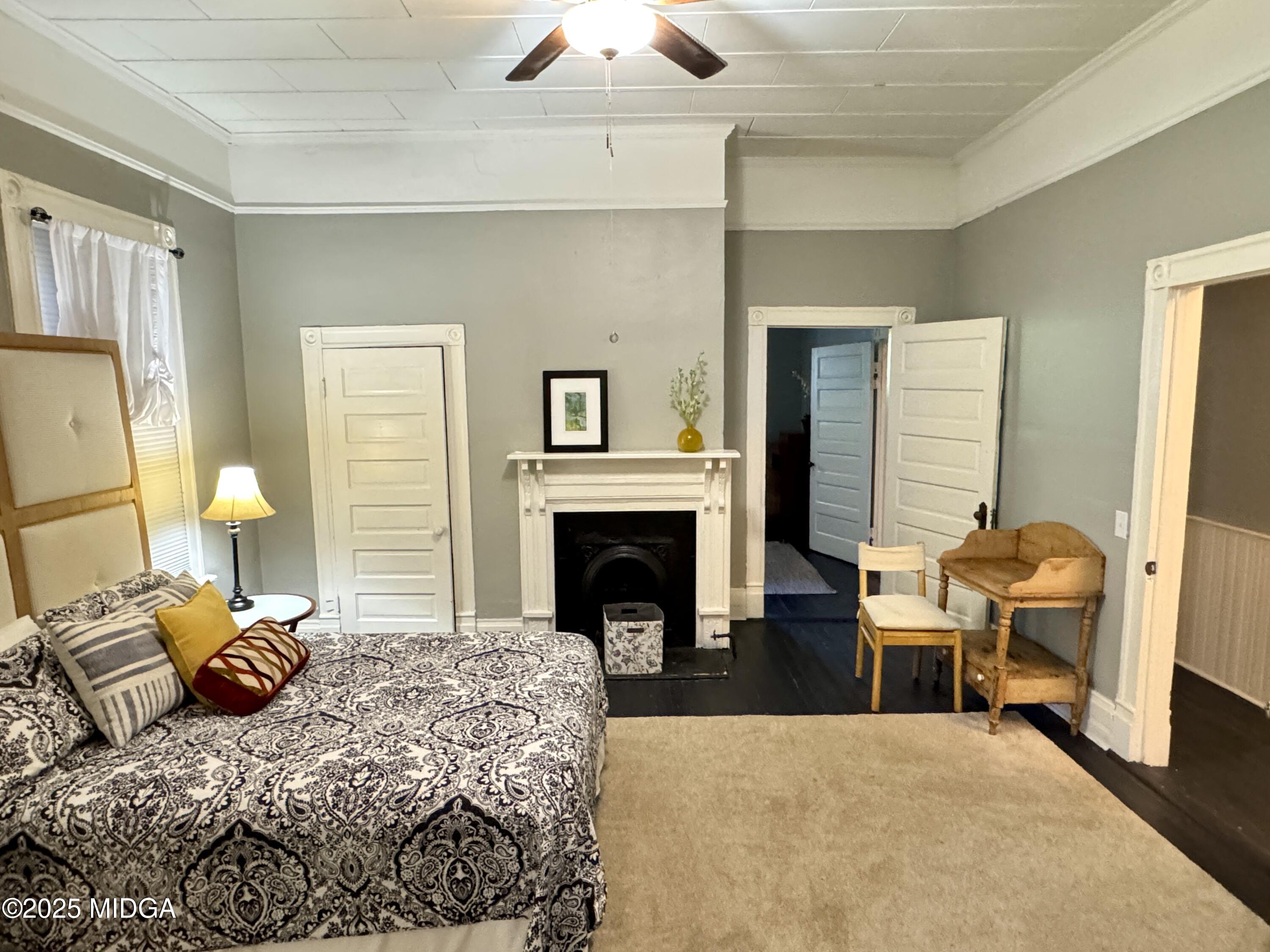 940 Cole Street Macon, GA 31201 - Photo 9 of 22 a bedroom with a bed and a fireplace