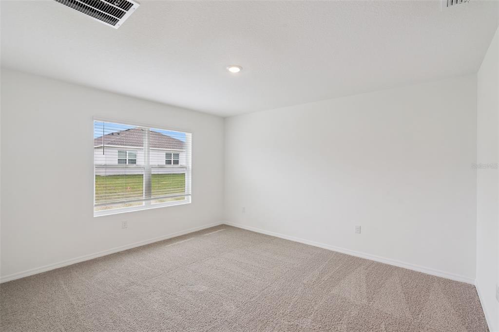 3506 Nettle Loop Tavares, FL 32778 - Photo 14 of 18 an empty room with a window