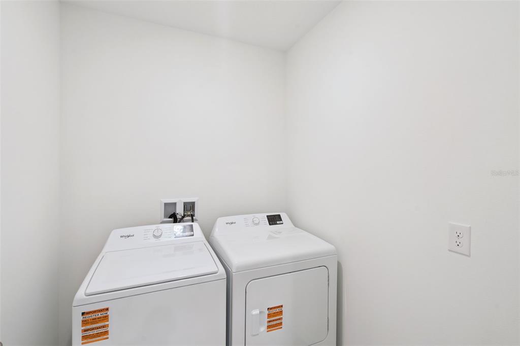 3506 Nettle Loop Tavares, FL 32778 - Photo 17 of 18 a utility room with dryer and washer