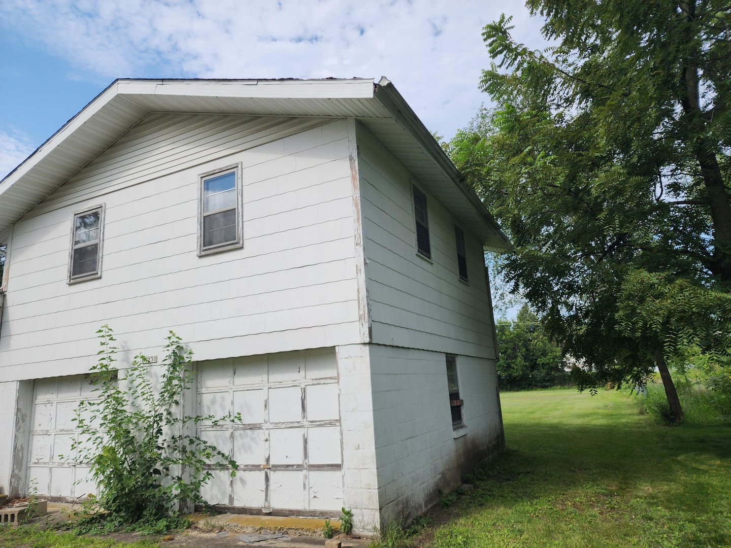 6S363 4th Street Eola, IL 60519 - Photo 2 of 18 a front view of a house with garden